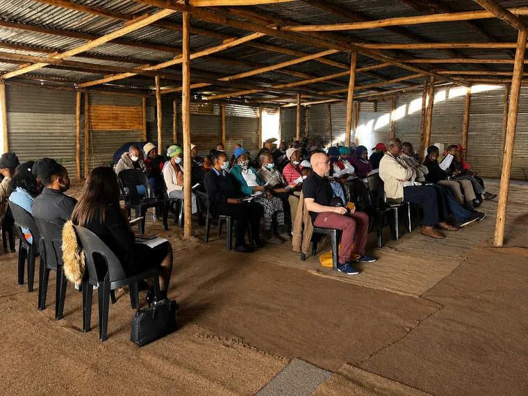 Audience participating in a gender-based violence awareness campaign