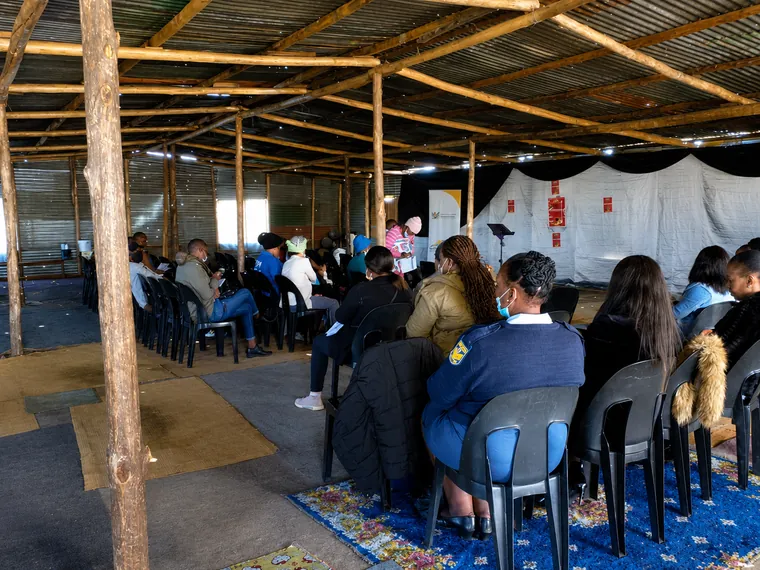 Community participants attending a gender-based violence awareness session